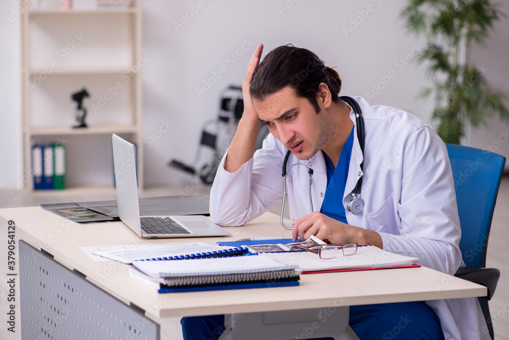 Young doctor working in the hospital Young doctor working in the hospital