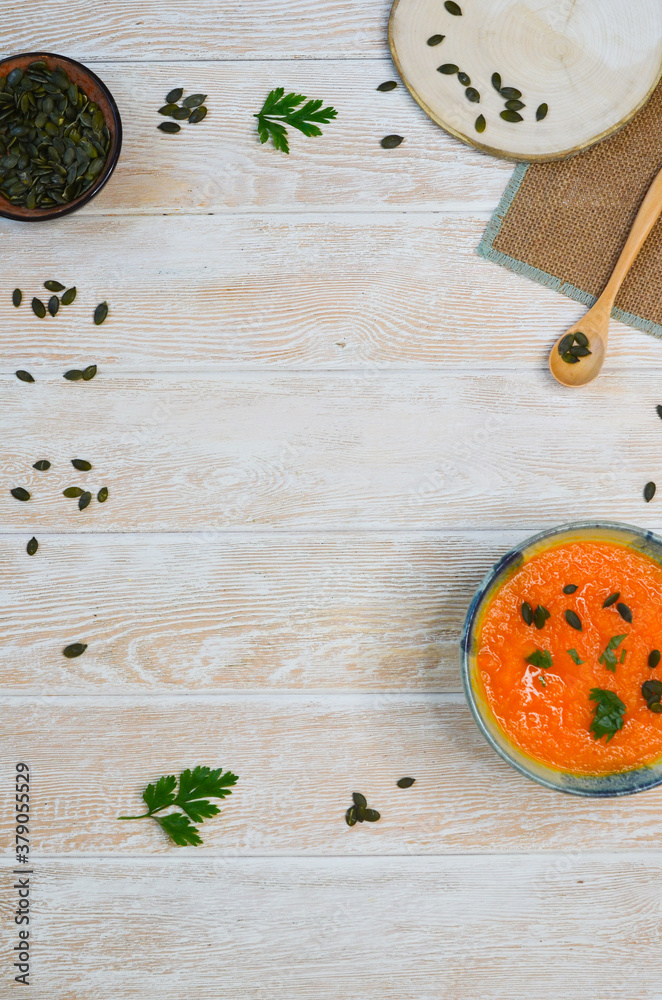 Autumn delicious food, hearty pumpkin soup top view, healthy nutrition on autumn dinner, the concept of thanksgiving day Autumn delicious food, hearty pumpkin soup top view, healthy nutrition on autumn dinner, the concept of thanksgiving day