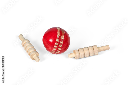 cricket ball and bails, red ball and white ball isolated on white background,  studio shot cutout photo