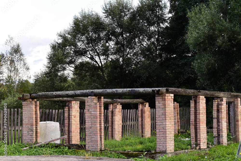 pillars of brick, the remains of a demolished barn pillars of brick, the remains of a demolished barn