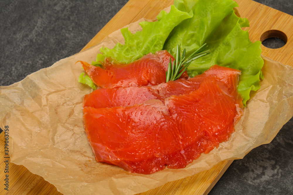 Sliced salmon fillet served rosemary Sliced salmon fillet served rosemary