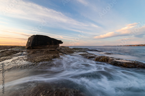 Sea water around a big rock in North Bondi coastline.