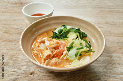 boiled seafood sukiyaki in soup with sauce
