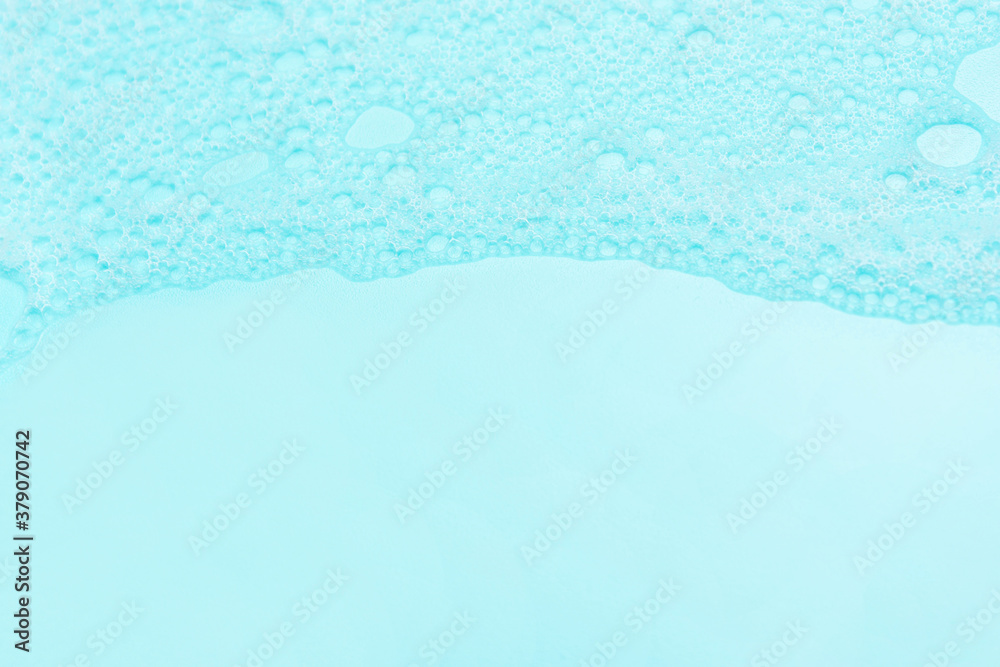 detergent foam, shampoo, soap bubbles on blue background. The concept of cleanliness, cleani