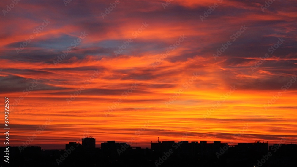 amazing colourful sunset over the city flats