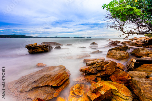 The sea spray hitting the rocks in the afternoon at Khao Laemya National Park Thailand. photo