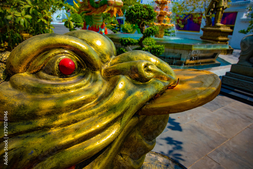 A statue flog at Suoi Tien park in Ho Chi Minh Vietnam photo