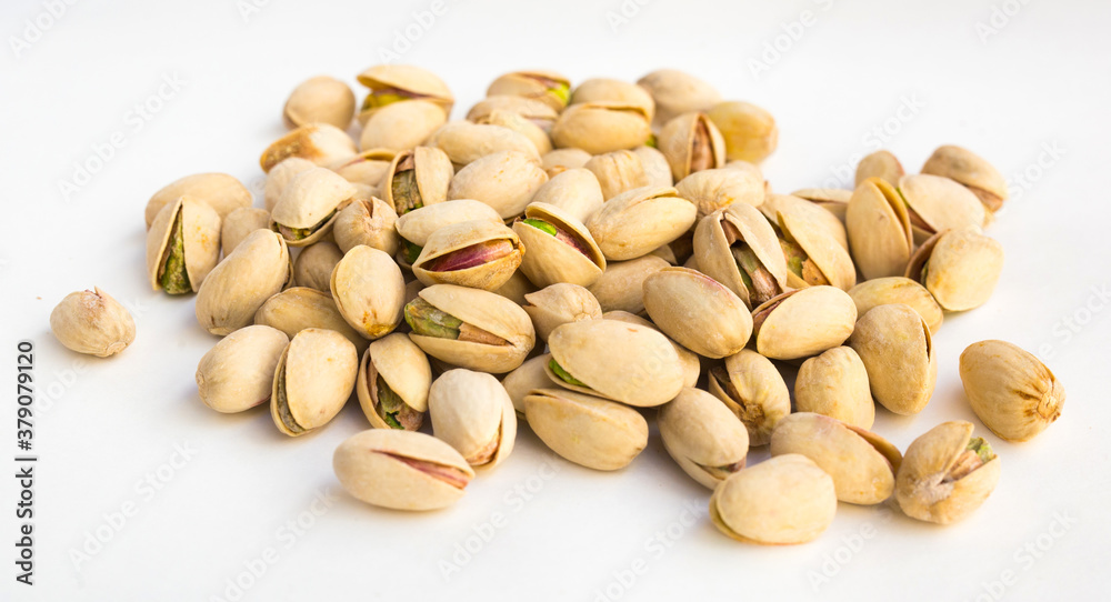 roasted pistachios on white background