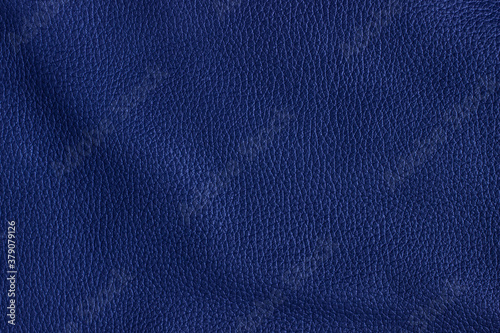 Dark blue or navy natural or genuine leather texture for background.