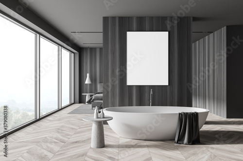 Stylish gray and wooden bathroom and bedroom interior with poster