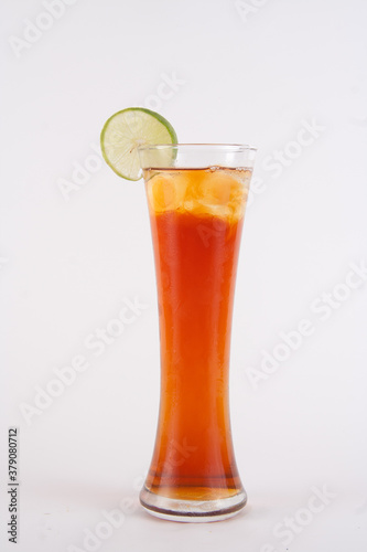 glass of ice tea with lemon on the white background