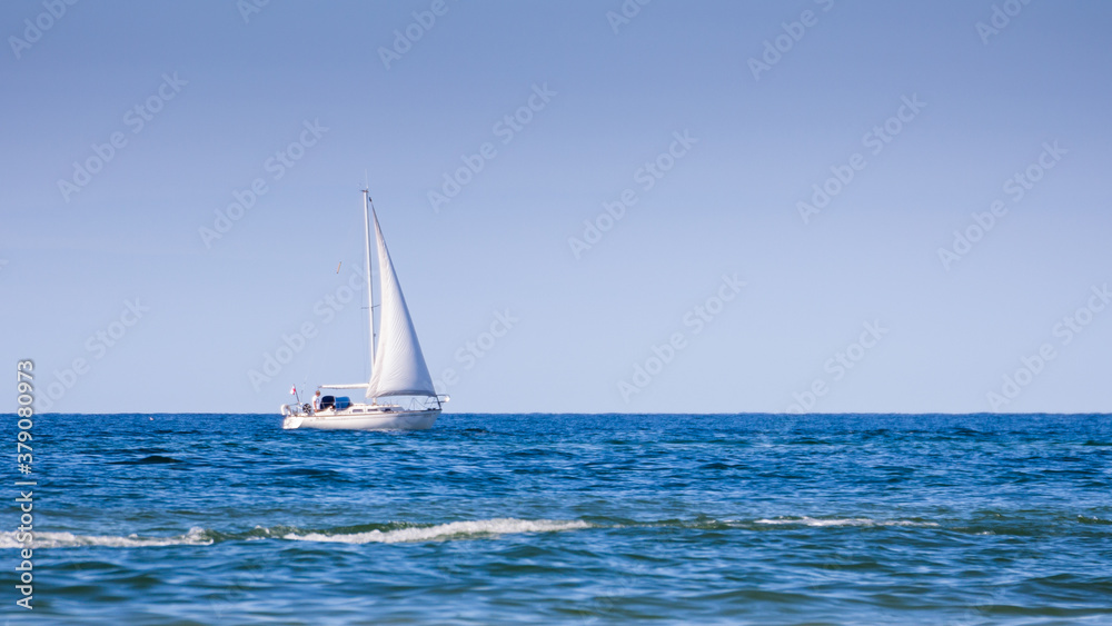 white sailing boat at sea Baltic