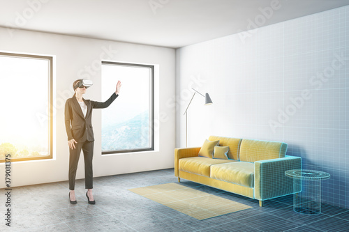Woman in VR glasses planning living room
