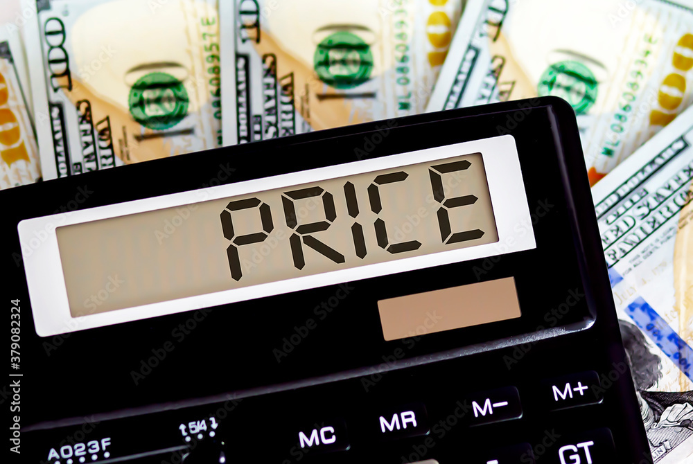 Calculator with text PRICE on the dollars. Business, finance conceptual. Calculator with text PRICE on the dollars. Business, finance conceptual.