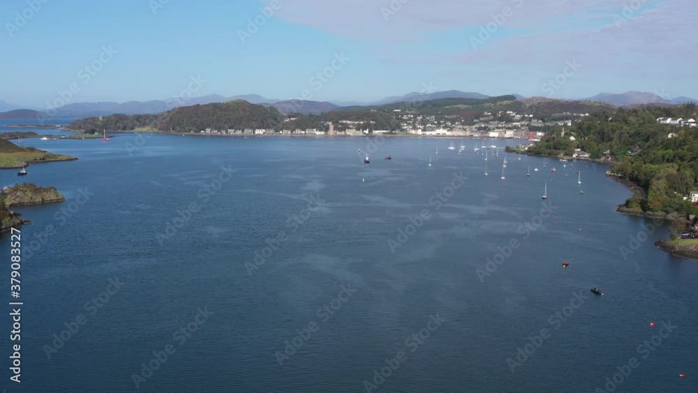 aerial view of the sound of kerrera and the island of kerrera near oban in the argyll region of the highlands of scotland during a clear blue calm day in autumn