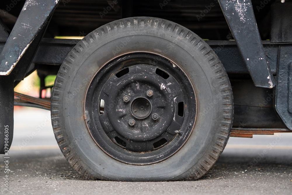 Closeup shot of a van with a flat tyre