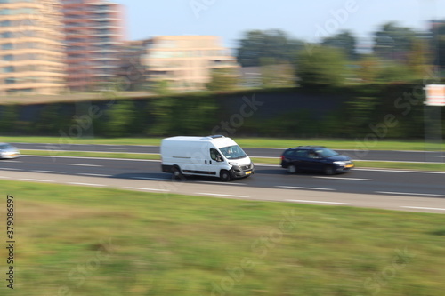 Van panning on highway.