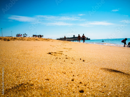people walking on the beach