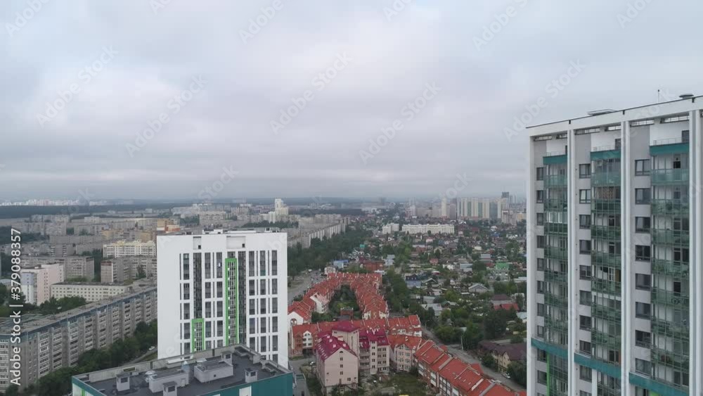 Aerial view of new modern, colorful, high-rise buildings on the outskirts of the city. Nearby area with one-storey houses and old panel houses. Cloudy summer morning
Aerial view of new modern, colorful, high-rise buildings on the outskirts of the city. Nearby area with one-storey houses and old panel houses. Cloudy summer morning