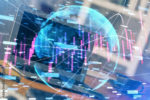 Financial graph colorful drawing and table with computer on background. Double exposure. Concept of international markets.