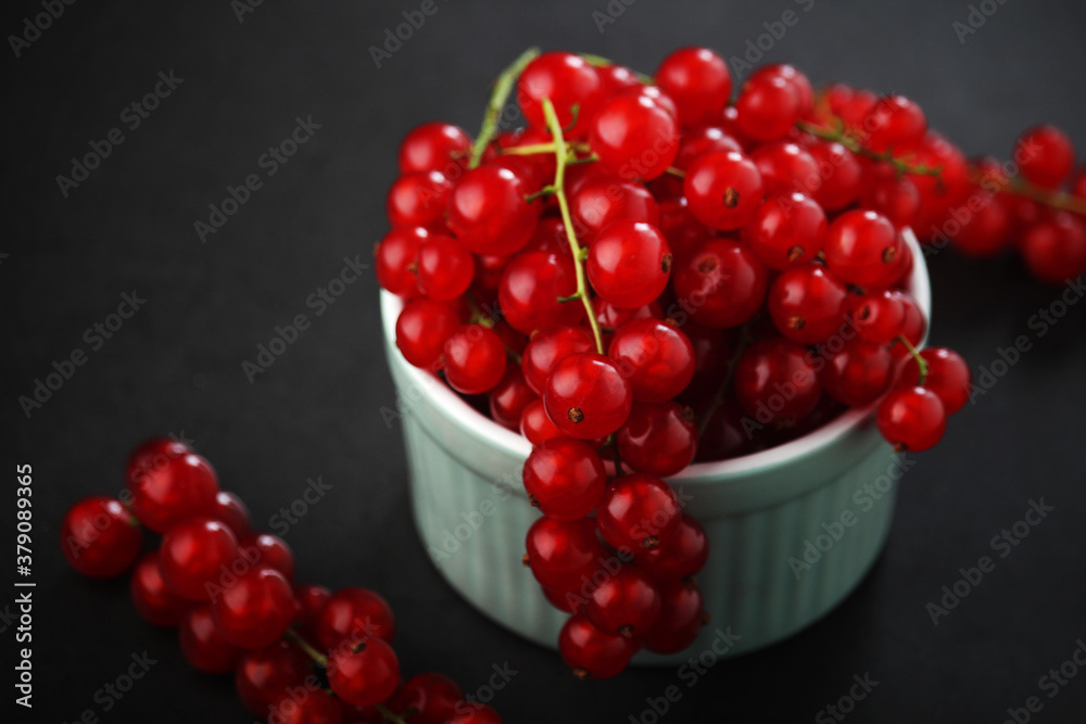 A ceramic bowl with red currant berries A ceramic bowl with red currant berries