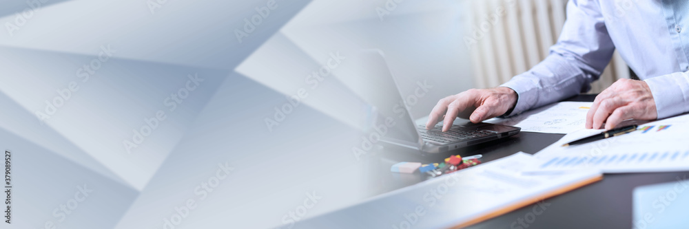 Fototapeta premium Hands of businessman using laptop, light effect; panoramic banner