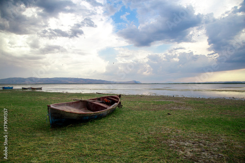 Abandoned boats by the lake. The lake view in the evening.