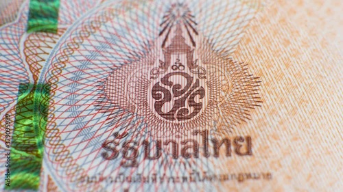 Monogram of King Maha Vajiralongkorn on brown 1000 baht banknote. Paper thai bill photo