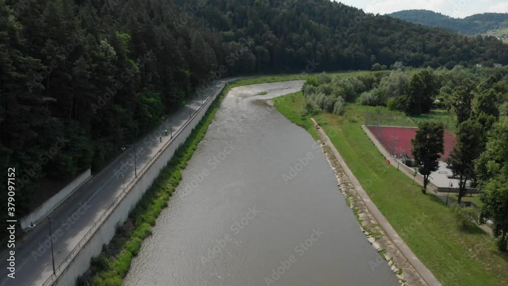 Flying over Poprad river in Piwniczna-Zdroj, Poland Flying over Poprad river in Piwniczna-Zdroj, Poland