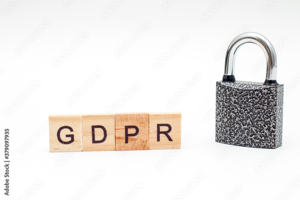 Word General Data Protection Regulation (GDPR) made from wooden blocks and metal Padlock on white background Word General Data Protection Regulation (GDPR) made from wooden blocks and metal Padlock on white background