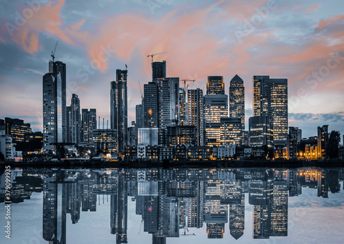 Photography City of London beautiful view with Skyscrapers and  dramatic sky at sunset and reflection in the Thames water