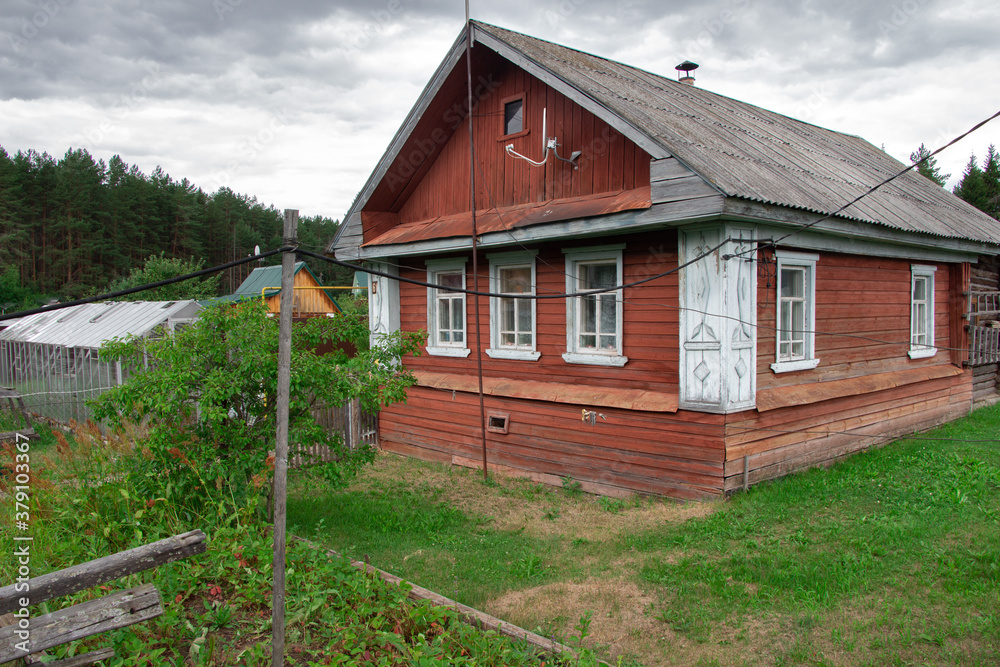 Photo of aged wooden house, facade view Photo of aged wooden house, facade view