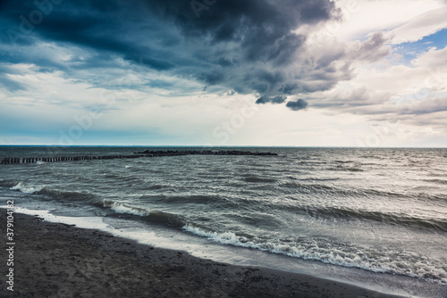 Storming sea with dark clouds in the autumn s morning. Sea landscape. 