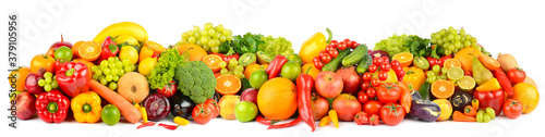 Wide panoramic composition of ripe fruits, berries and vegetables isolated on white