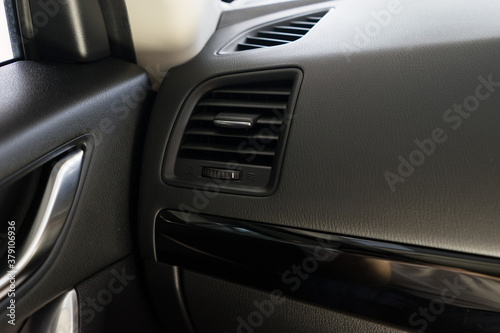 Air conditioner vent grill in a modern car © Lodimup