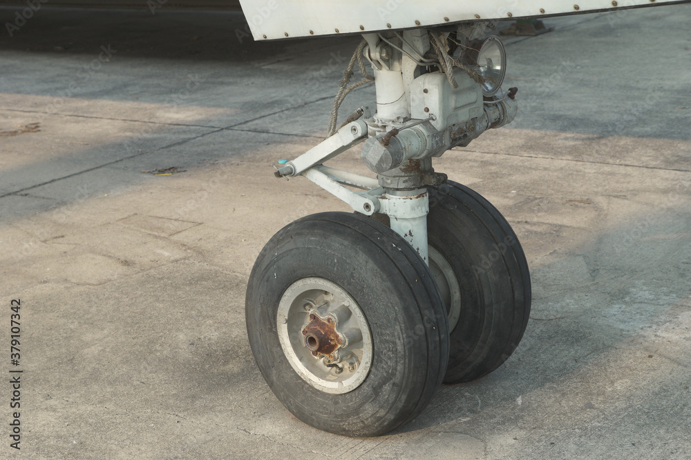 Close up on an airplane front wheel Close up on an airplane front wheel