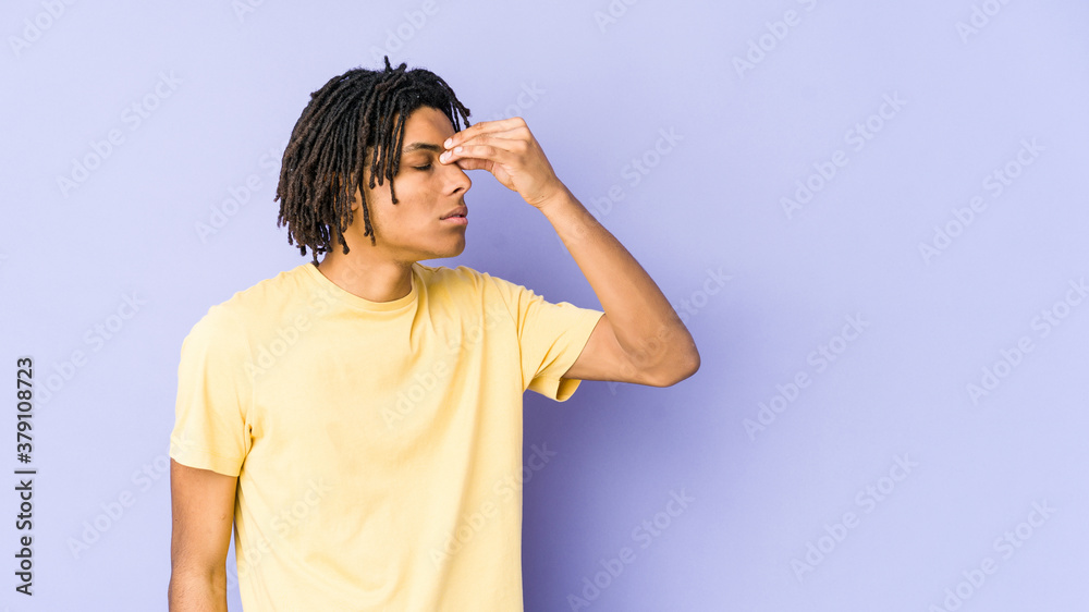 Young african american rasta man having a head ache, touching front of the face. Young african american rasta man having a head ache, touching front of the face.