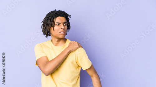 Young african american rasta man having a shoulder pain.