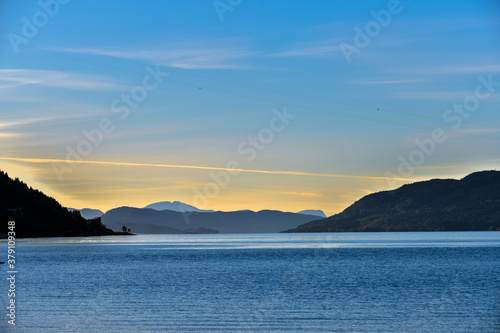 view of the lake and mountains at sunset
