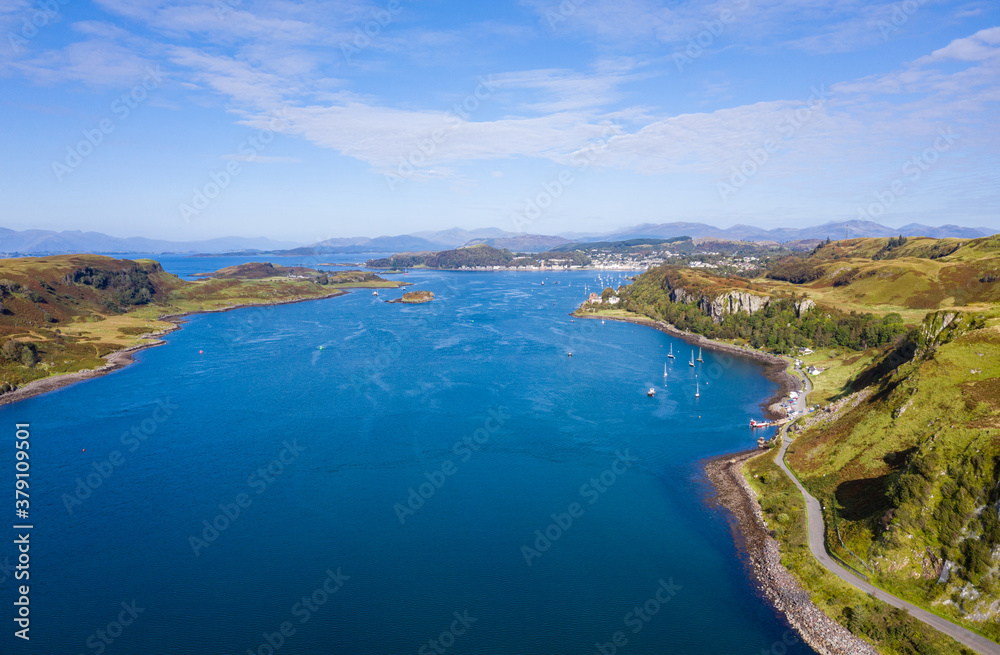 aerial view of the sound of kerrera and the island of kerrera near oban in the argyll region of the highlands of scotland during a clear blue calm day in autumn