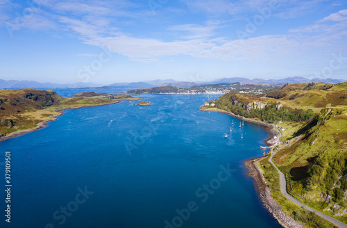 aerial view of the sound of kerrera and the island of kerrera near oban in the argyll region of the highlands of scotland during a clear blue calm day in autumn