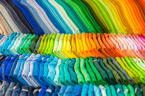Lines of colorful clothing from clothes store