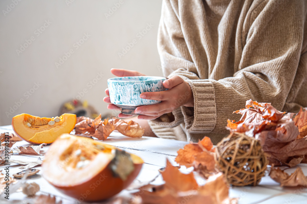 Autumn composition with leaves and a Cup of tea on a white background