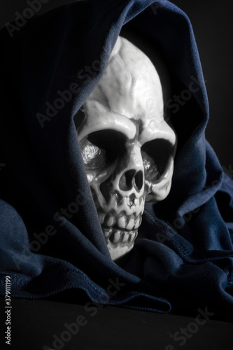  plastic human skull on black background