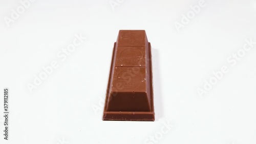 slicing kit kat on isolated background. animation shows inside of Chocolate bar with caramel 4K