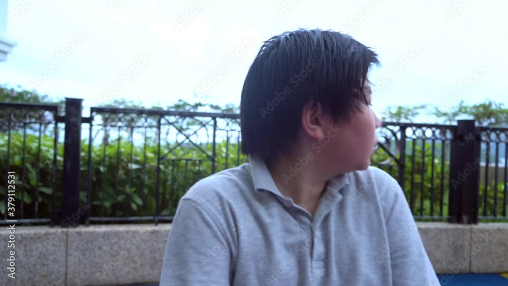 Asian boy feels afraid alone outdoor, panic disorder, depression Asian boy feels afraid alone outdoor, panic disorder, depression