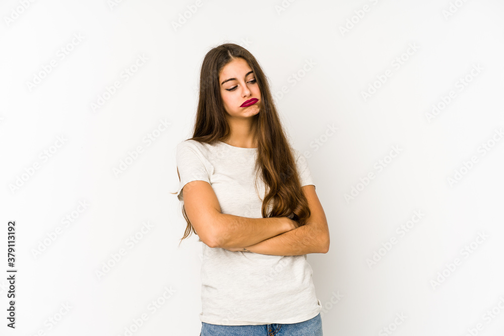 Young caucasian woman isolated on white background tired of a repetitive task.
