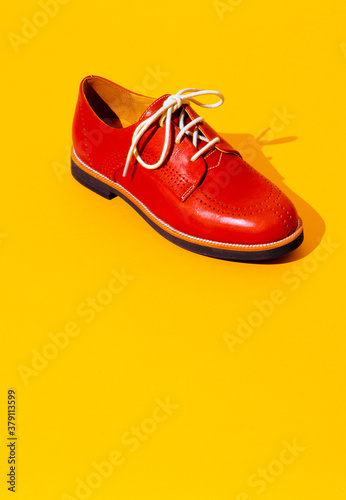 Vintage stylish shoes in isometric on yellow background. Minimal fashion concept