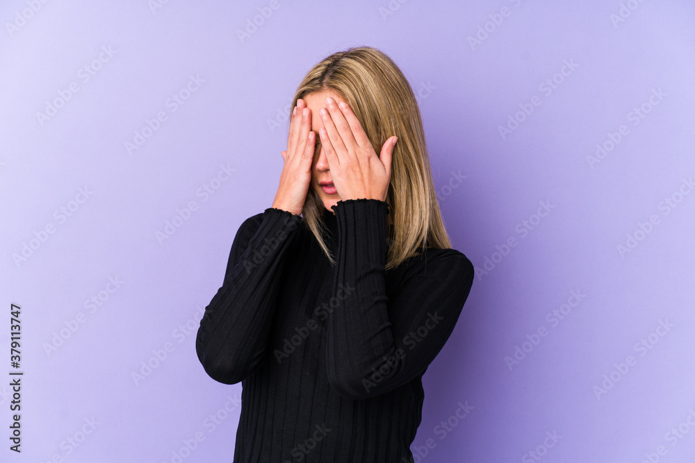 Young blonde caucasian woman isolated afraid covering eyes with hands. Young blonde caucasian woman isolated afraid covering eyes with hands.