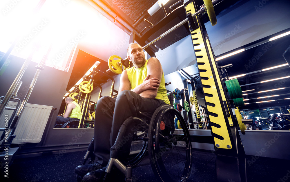 Disabled man training in the gym of rehabilitation center
